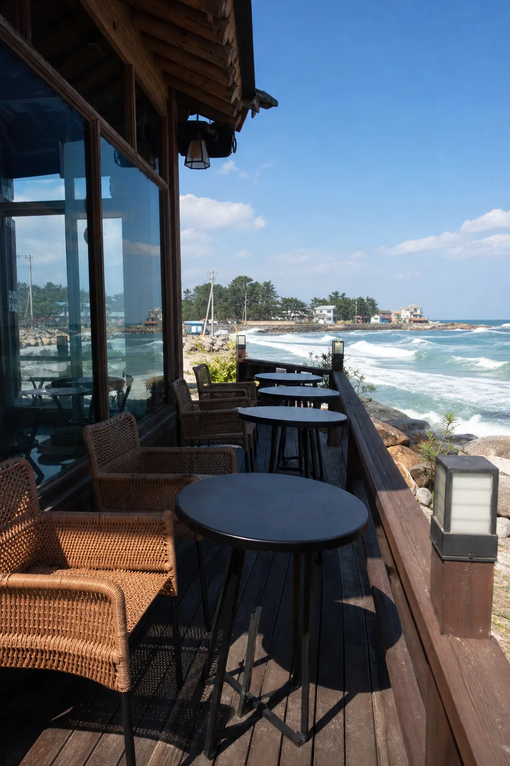 An outdoor café deck beside the sea