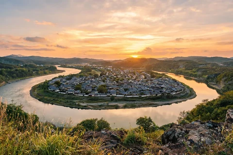 Illustrative sunset overview of Hahoe Village inside the river bend