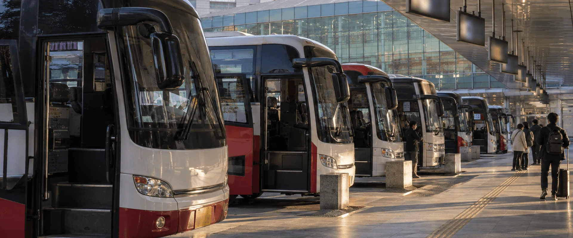 Buses lined up in the boarding lanes of an express bus terminal