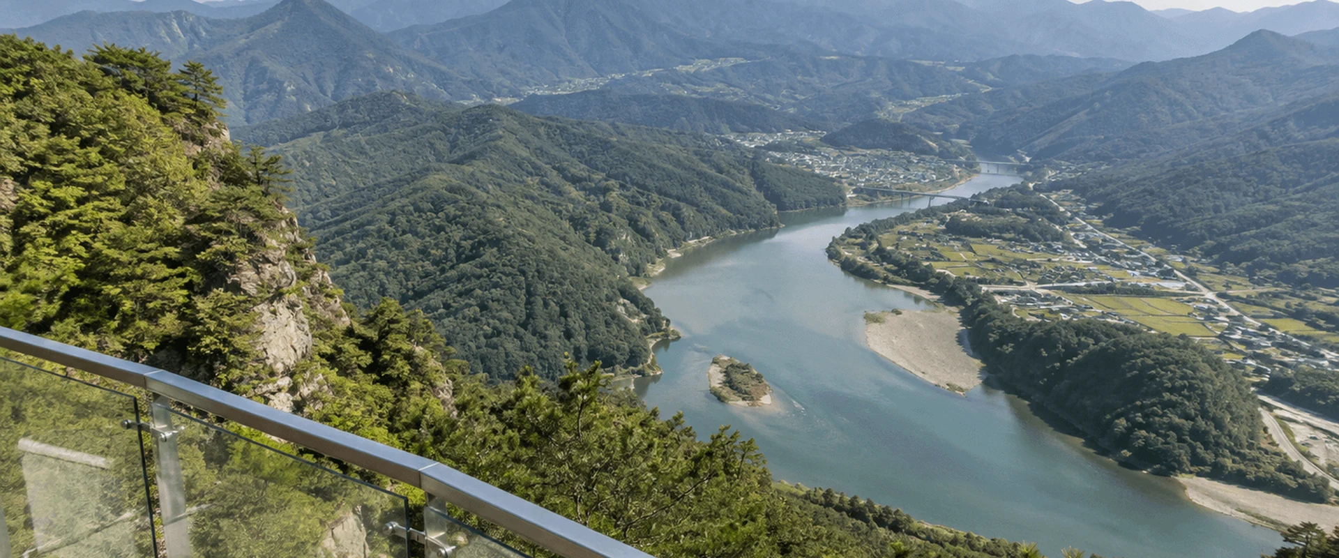 An example image of the river and ridgelines seen from the glass viewpoint of Mancheonha Skywalk