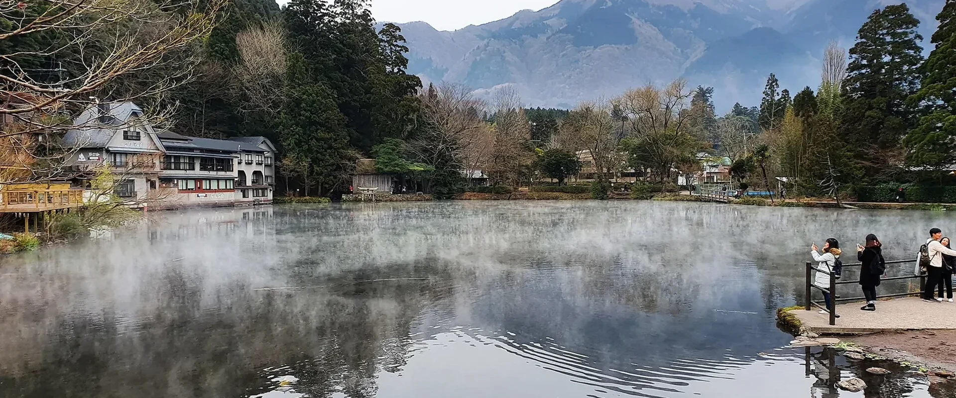 Mist rising from Lake Kinrin on a cold morning in Yufuin