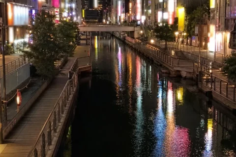 Dotonbori canal with evening neon reflections
