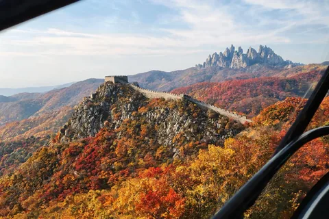 Illustrative Seoraksan cable car above an autumn ridge