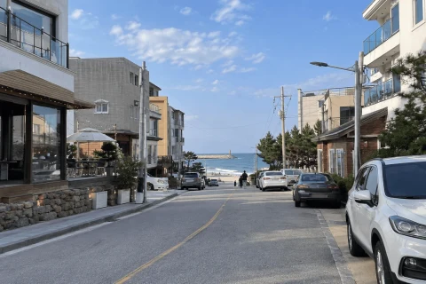 Illustrative coastal lodging scene for a Sokcho stay