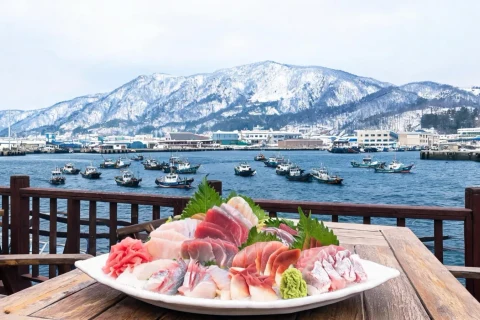 Illustrative harbor-and-sashimi scene, not a verified restaurant