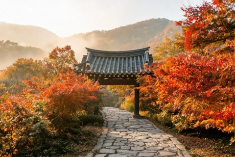 Illustrative autumn mountain trail with a traditional gate