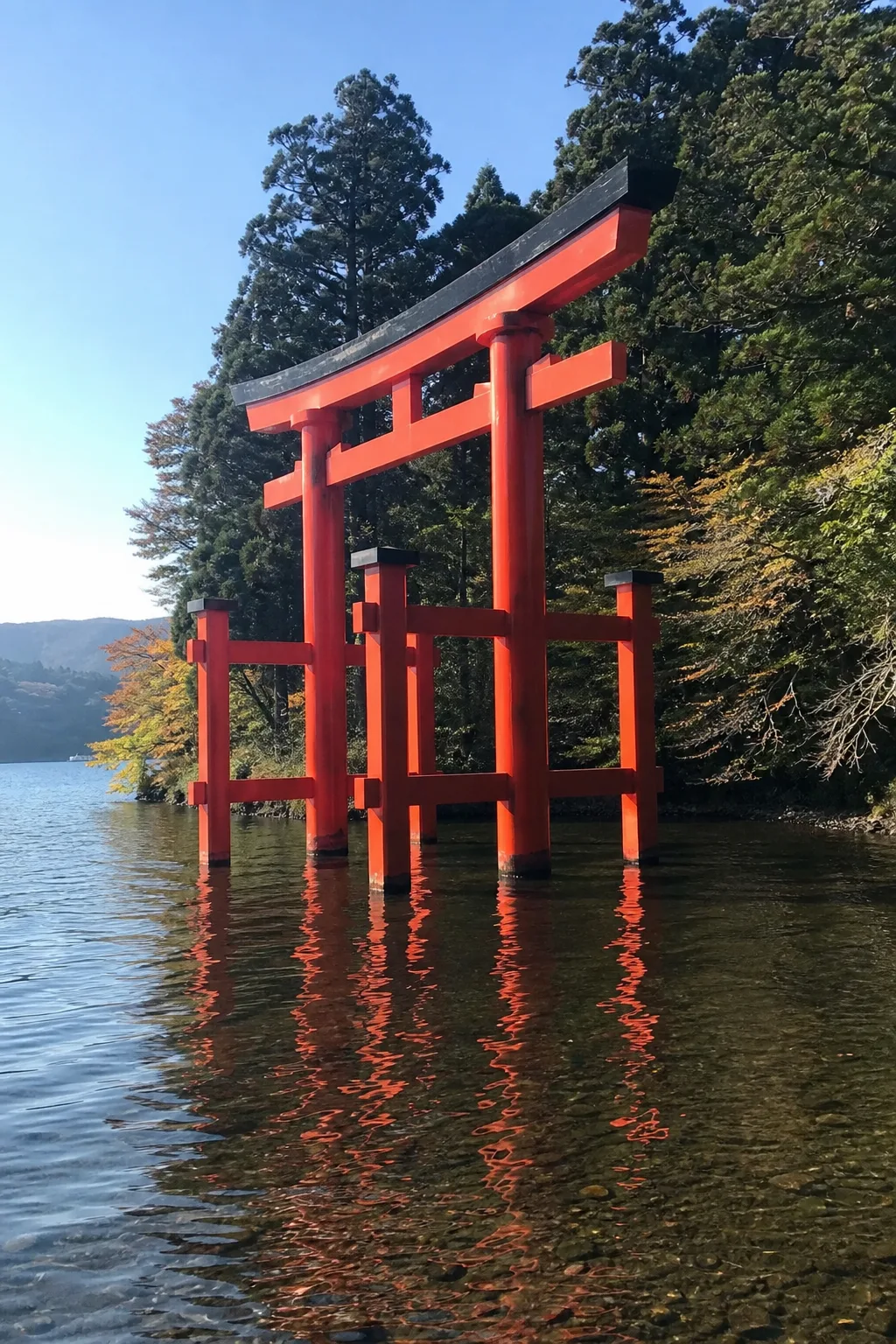 Vermilion Torii of Peace standing in Lake Ashi