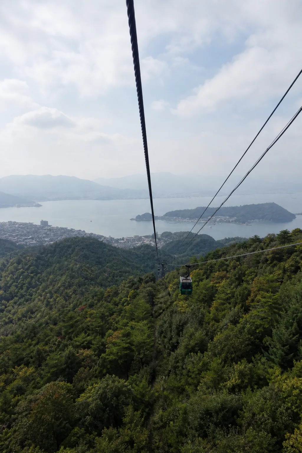 The Miyajima Ropeway gondola above the forest on the way to Mt. Misen