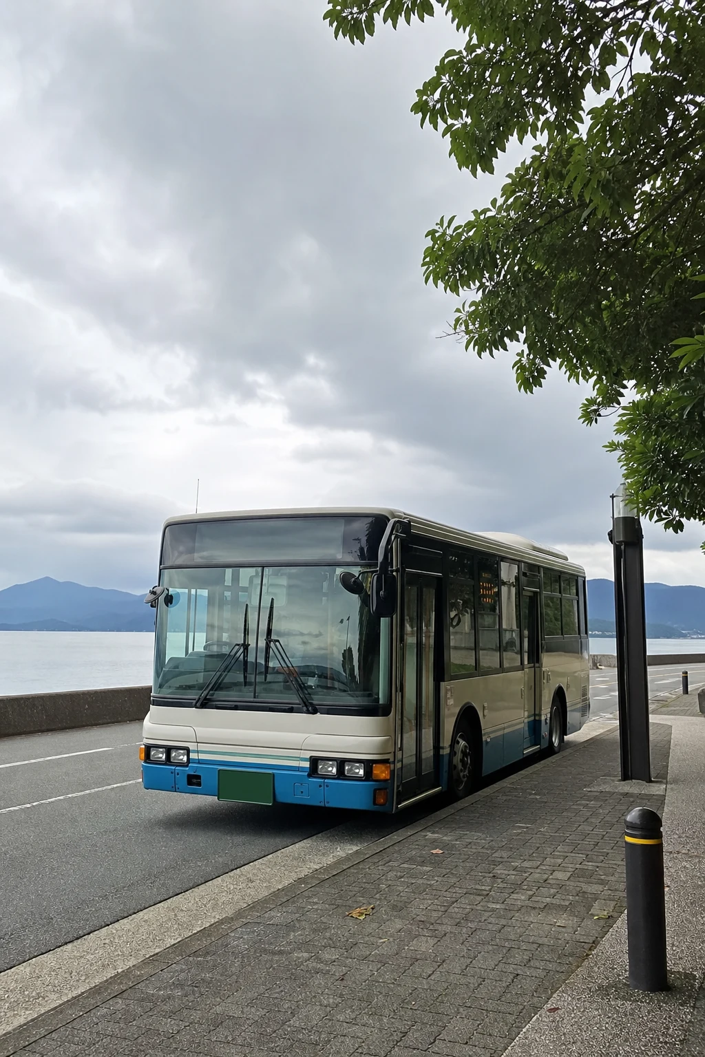 Local bus at a coastal stop, illustrative scene