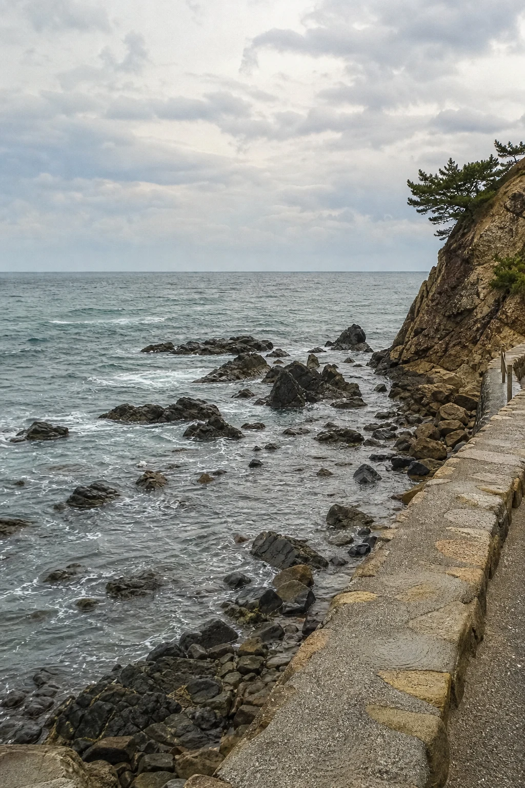 Rocky coastal walkway, illustrative scene