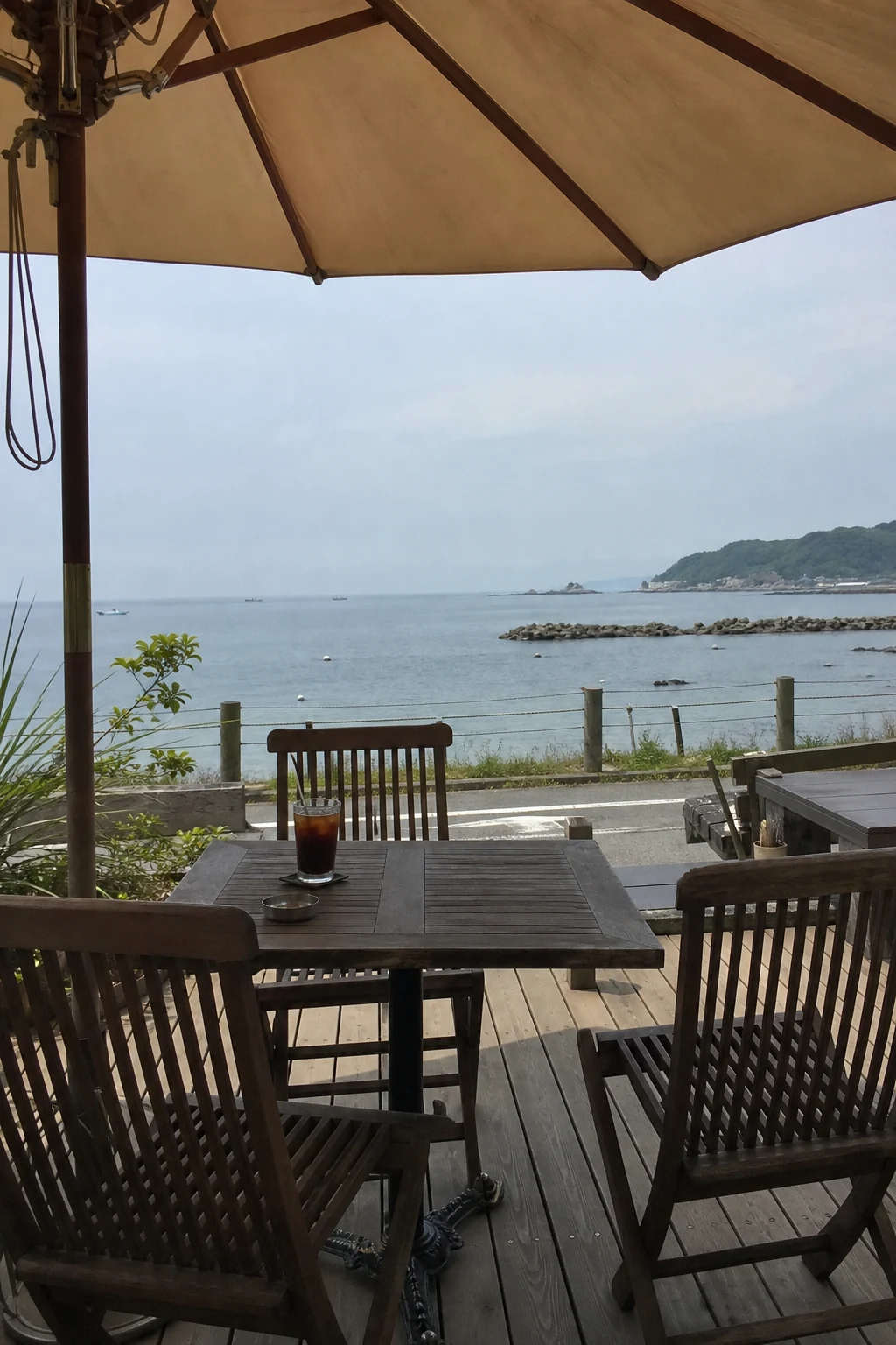 Sea-facing cafe terrace, illustrative scene