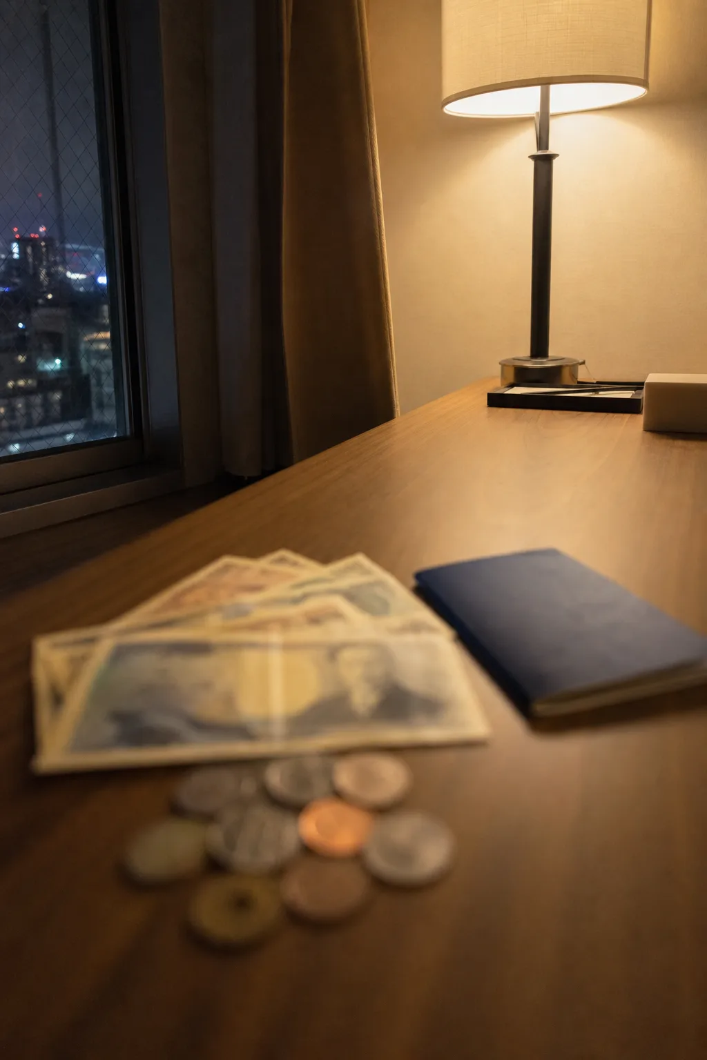 Japanese yen banknotes and coins on a desk