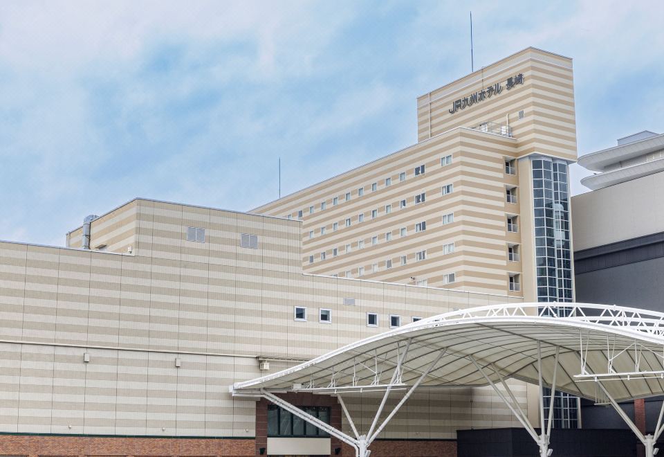JR Kyushu Hotel Nagasaki building with its hotel sign above the station-area plaza.