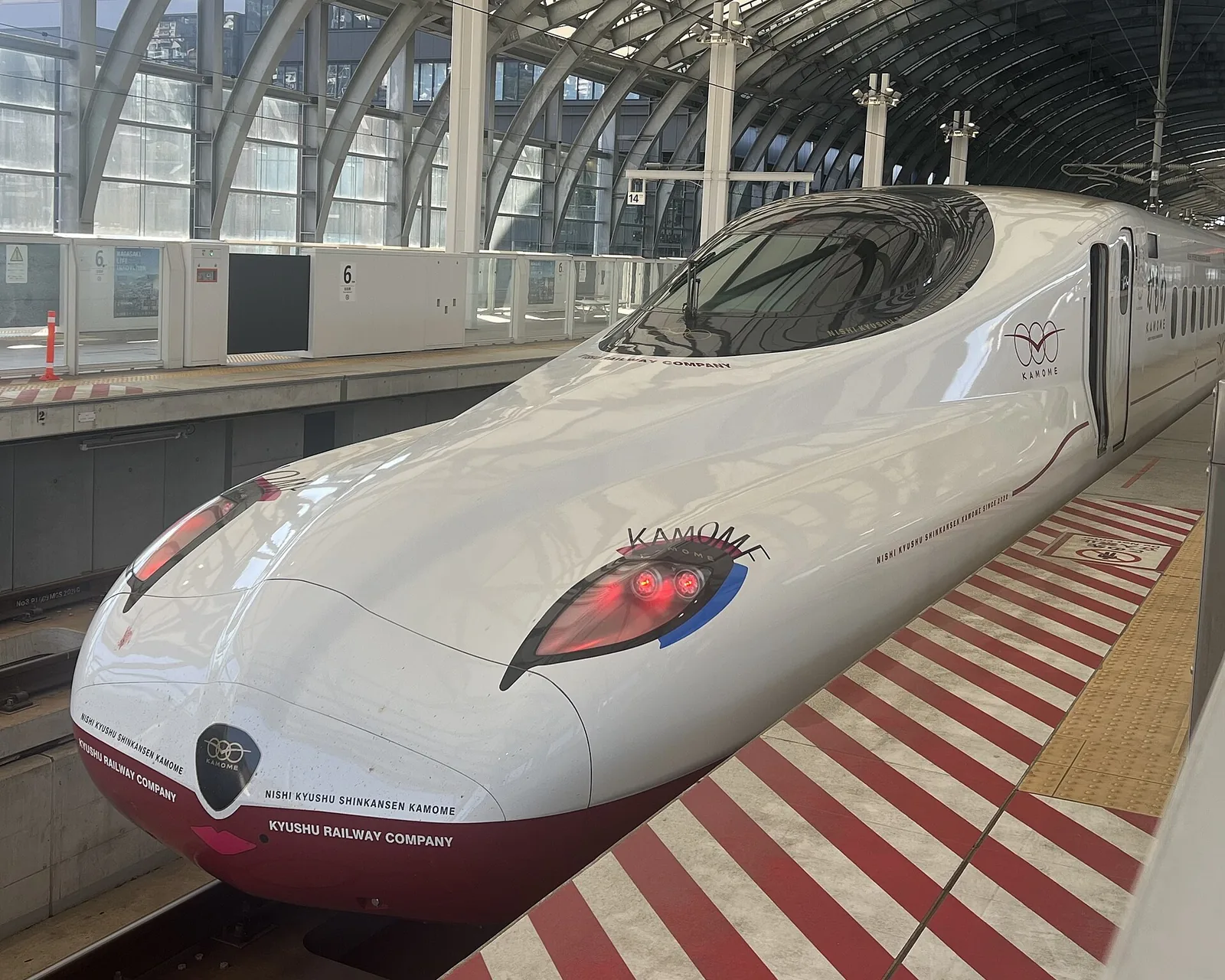 A white N700S Kamome shinkansen at a platform in Nagasaki Station