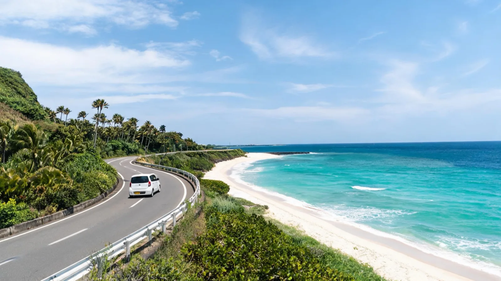 A rental car driving along Okinawa's coastal road